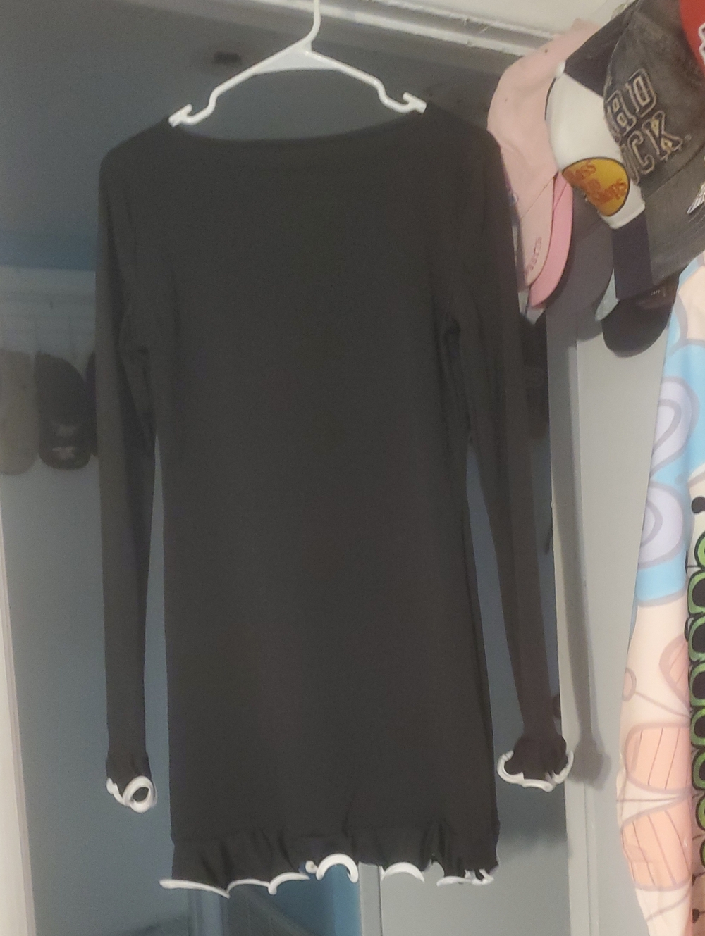 Black Long-Sleeve Ruffle Hem Mini Dress Brand New.